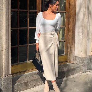 Nanushka soft faux leather wrap midi skirt cream